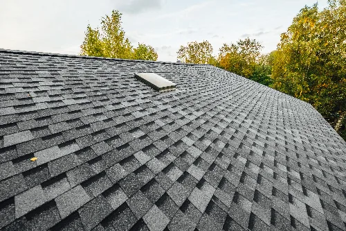Re-roofing project with new shingles laid over existing roof deck