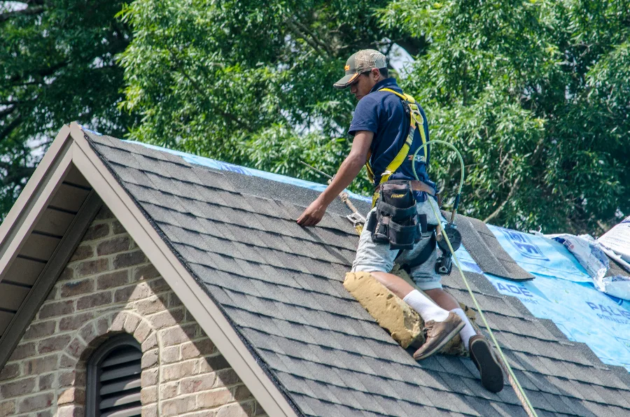 Strike Roofing crew installing a new residential roof in Utah
